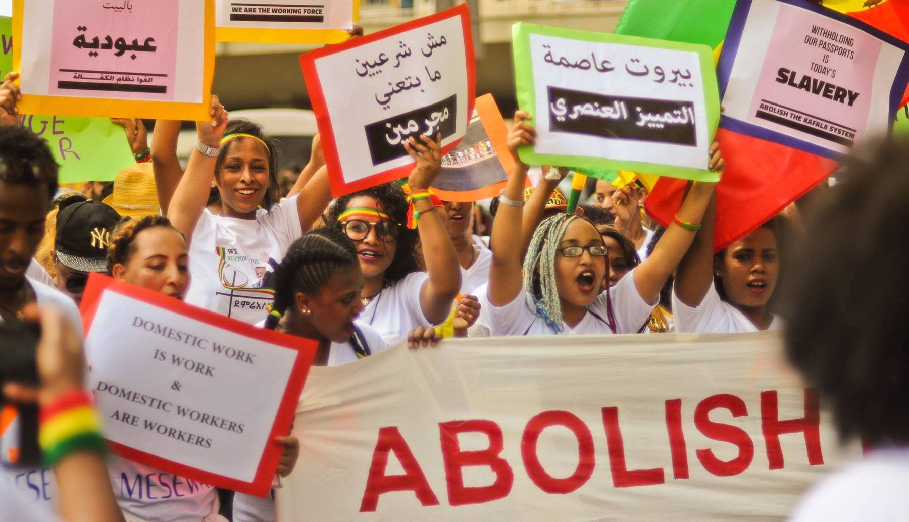 Potesters call for the abolition of the kafala system at the Domestic Workers' Day protest 2018. One of the signs read: "Beirut, the capital of racist discrimination" (Photo: Pat Sy, June 2018, published on Anti-Racism Movement's facebook page)