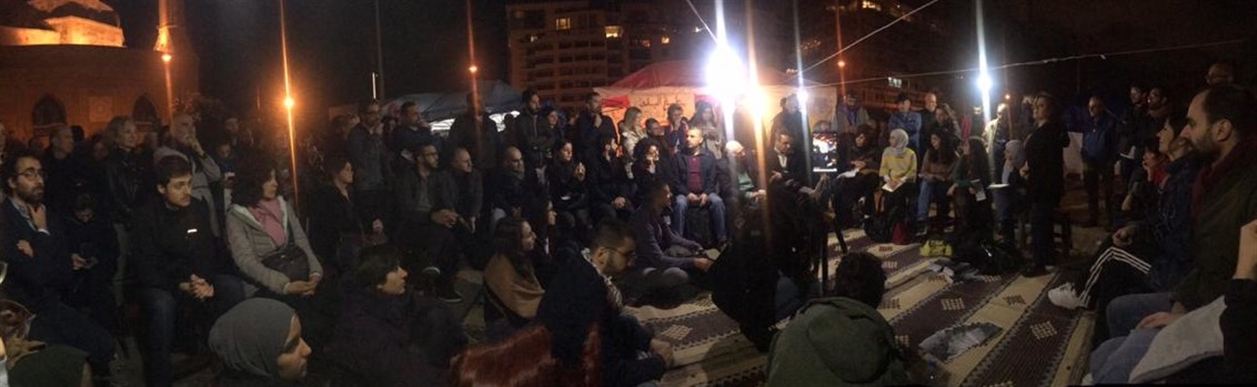 Abir Zaatari, Mona Fawaz, Yara Nahle, and Soha Mneimneh present the lab's work on housing in a public debate organized in the streets by urban activists (Photo: Isabela Serhan, December 2019)