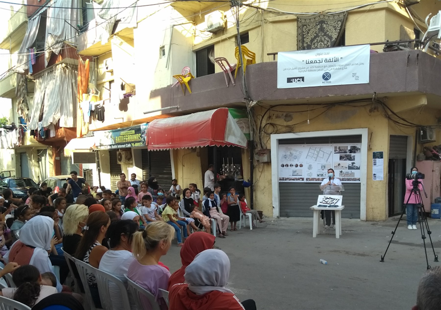 Protection project coordinator at ACTED Hajar Chamoun with Al Khodor neighborhood residents (Photo: Ali Ghaddar, August 2021)