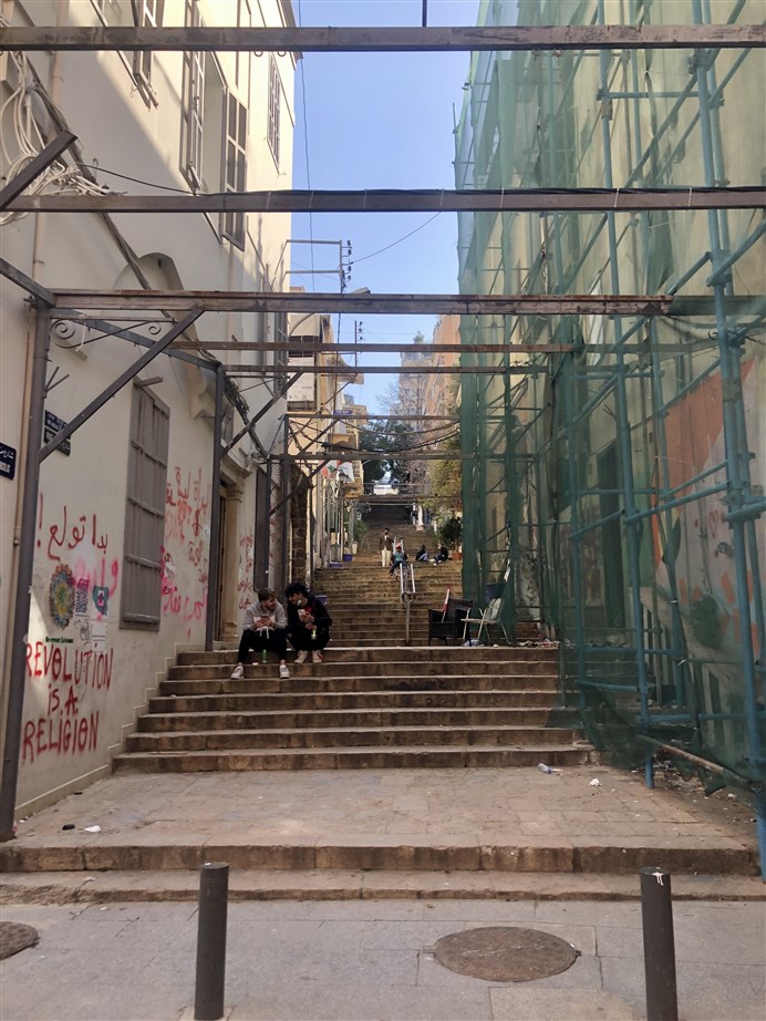 Young people hanging out on the stairs of Gemmayzeh. (Photo: Luna Dayekh)