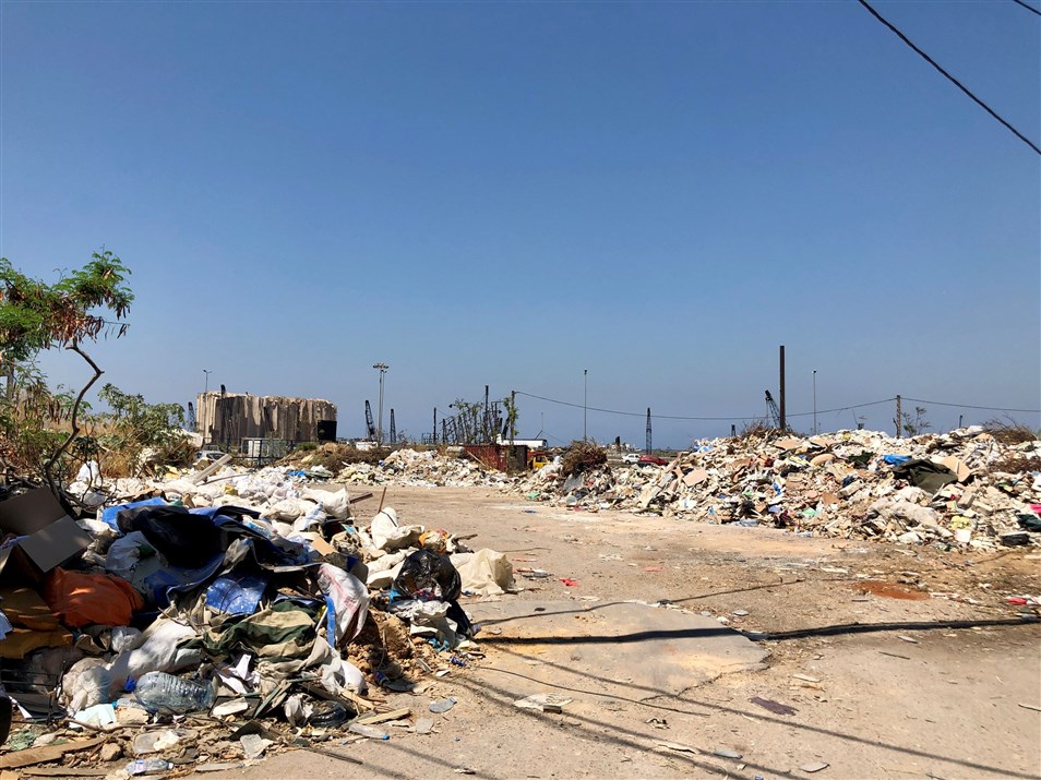 The port and accumulated waste on the sides of the street as seen from Mar Mikhael. (Photo: Luna Dayekh)